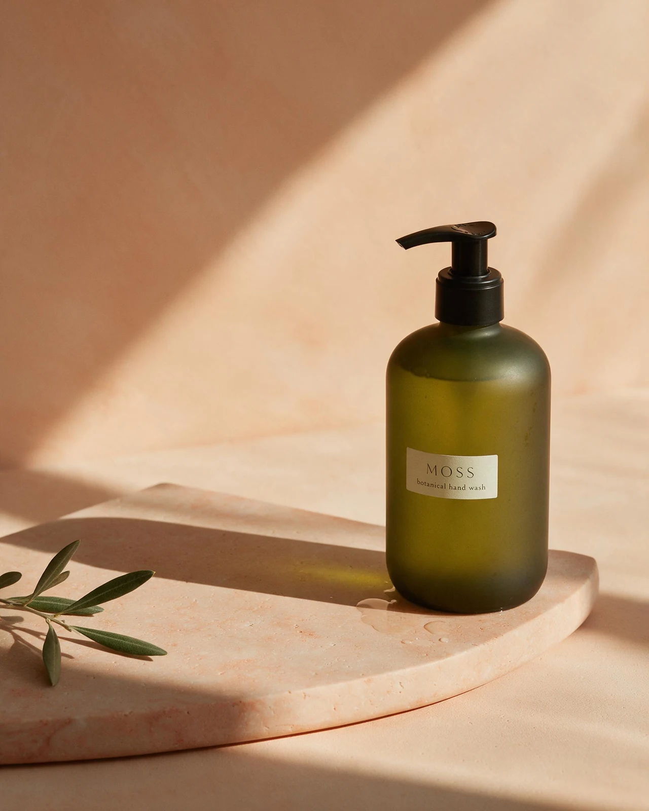 Fictional Moss botanical hand wash in an editorial product campaign